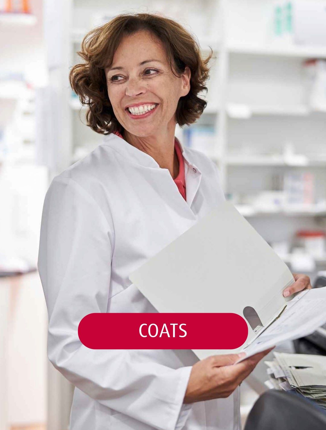 A pharmacist wearing a BP lab coat and holding a folder in her hand