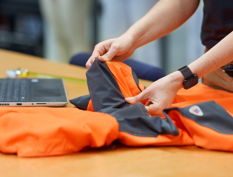 BP employee checks the quality of a high-visibility jacket.