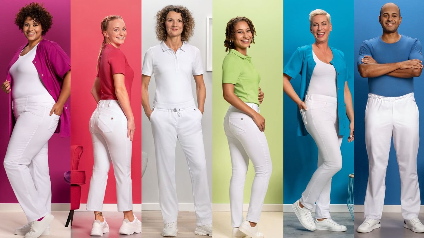 Sechs Pflegekräfte in verschiedenfarbiger BP-Pflegebekleidung.