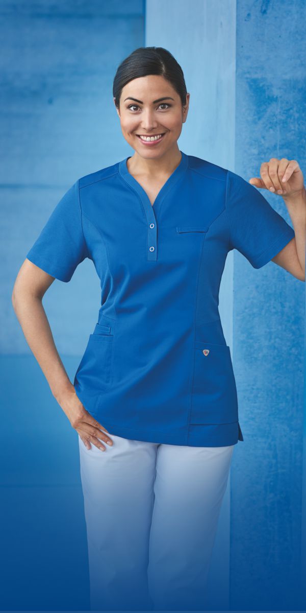 A woman is wearing a light blue tunic.