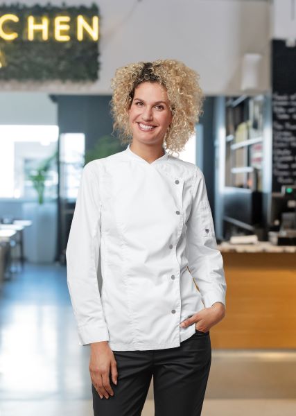 Cook wears a chef's jacket for women.
