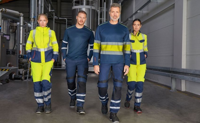 Team aus Frauen und Männern i9n Multinorm-Warnschutzkleidung.