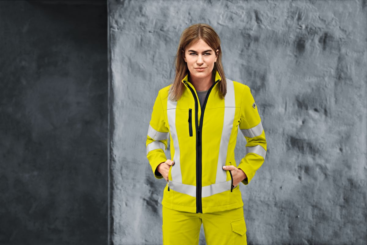 Woman in warning yellow BP high-visibility clothing.